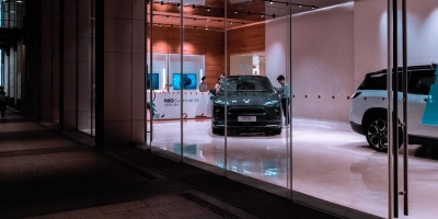 new cars seen inside the window of a dealership