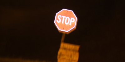 glowing stop sign at night