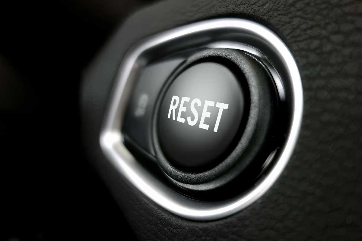 A black button with the word RESET on it