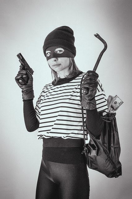 Woman dressed as a robber, carrying a pistol, a crowbar, and a backpack overflowing with cash