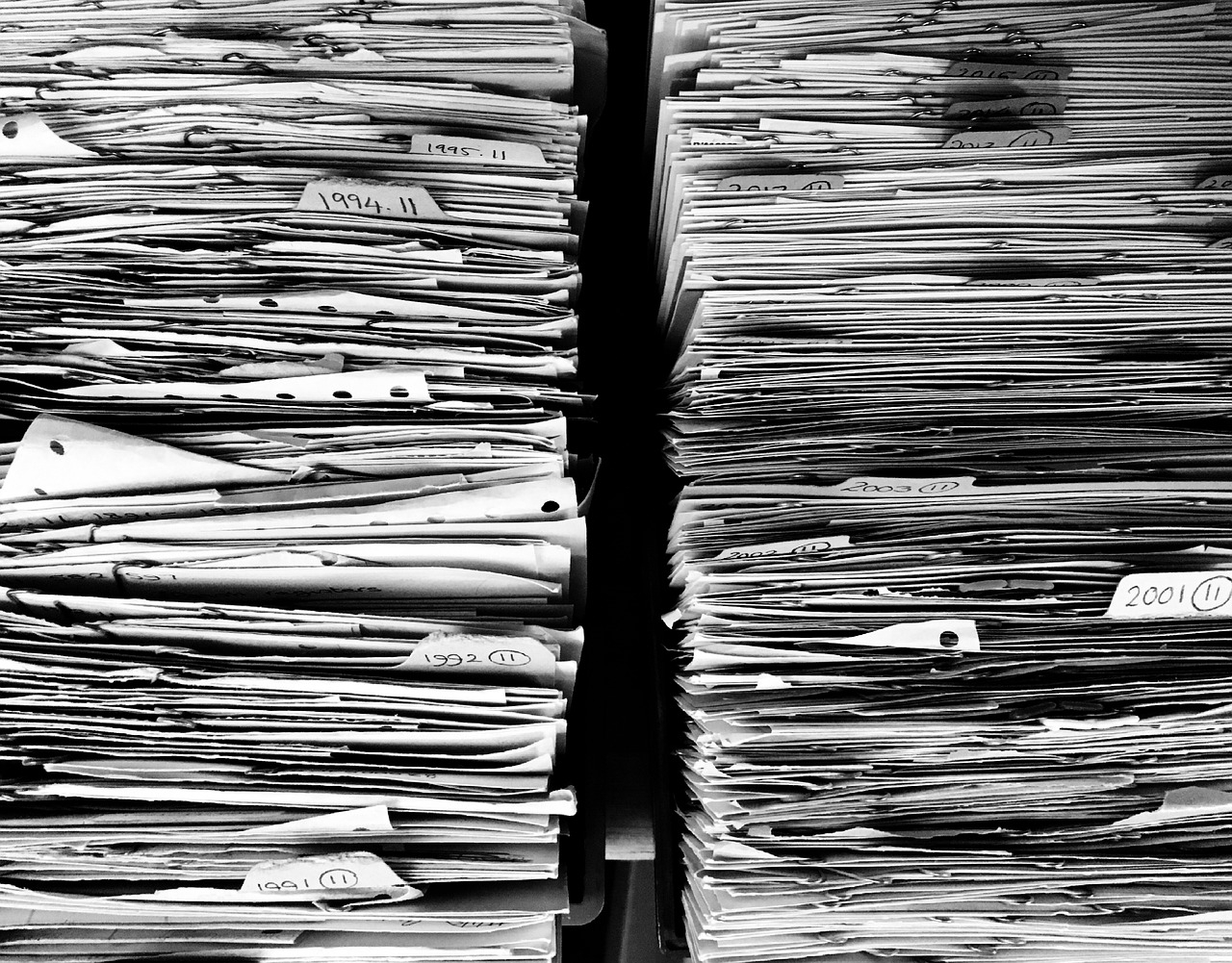 Two huge stacks of paper records