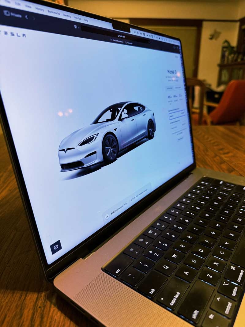 Notebook computer with a browser open to the Tesla website